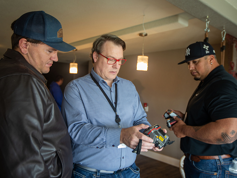 Chad Reisenauer, Basin Electric's director of Community & Member Support, shows class attendees how to use a thermal imaging camera in a home.