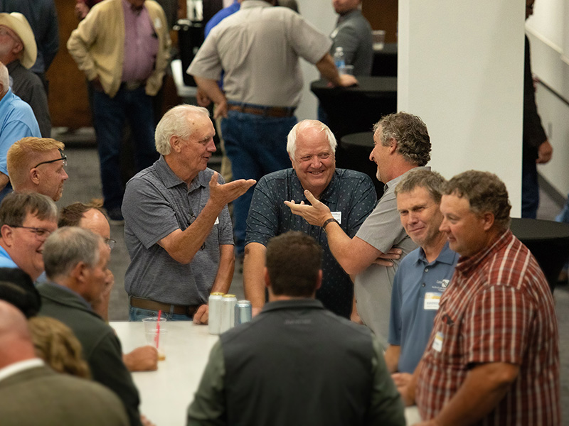 Members talking at reception