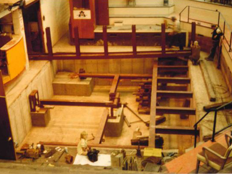 1983 photo depicting a little girl and her father installing a scale in a livestock ring