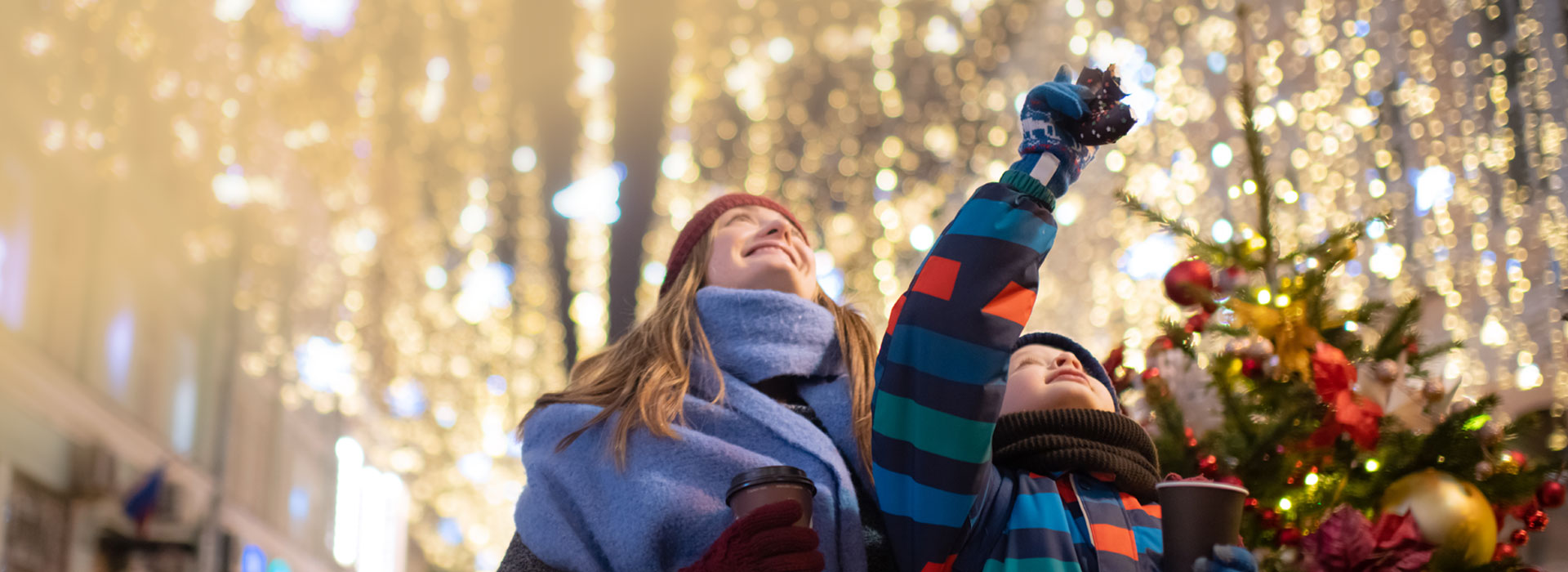 Mother and child looking at christmas lights