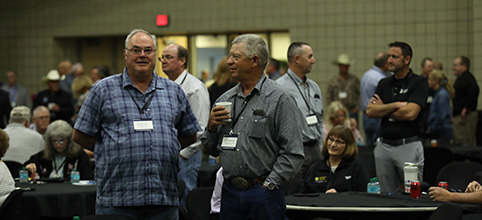 men talking at meeting