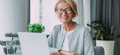 Woman with glasses at computer