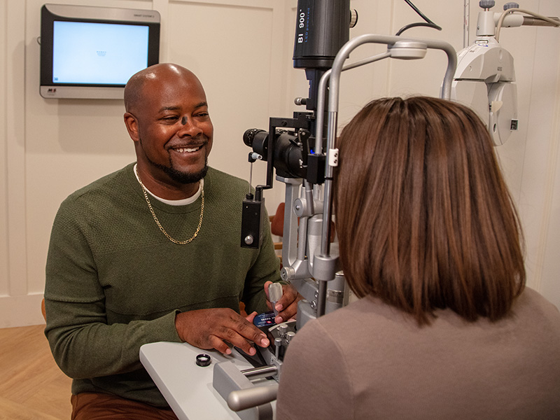 Eye doctor conducting exam