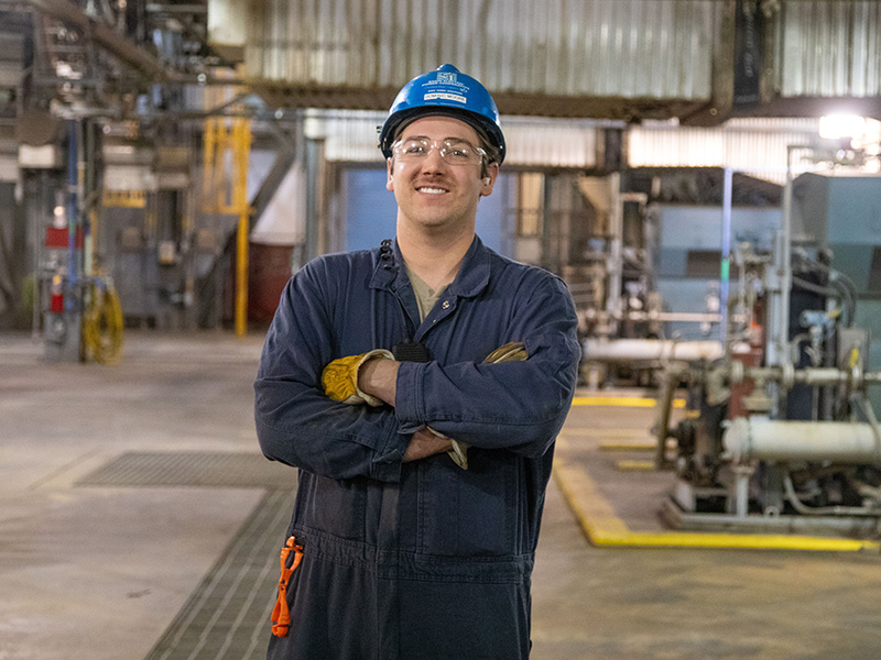 Employee standing in his work environment